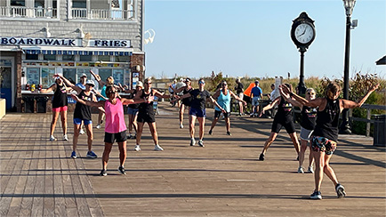 A fitness class on the boardwalk at Bethany Beach, Delaware